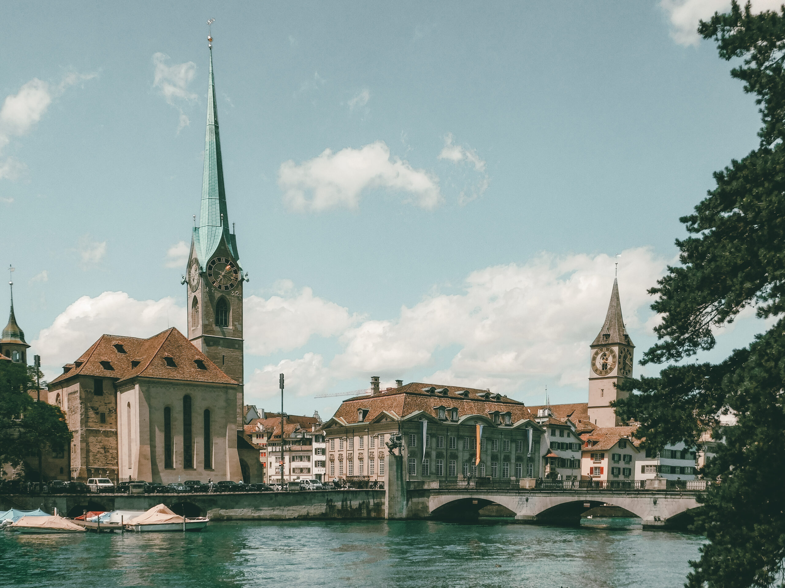 view of fraumunster church with limmat river zurich and buildings