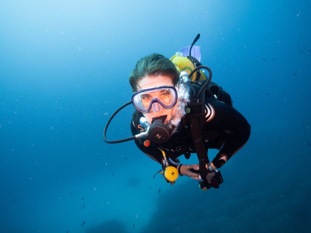 woman scuba diving with smile in malta