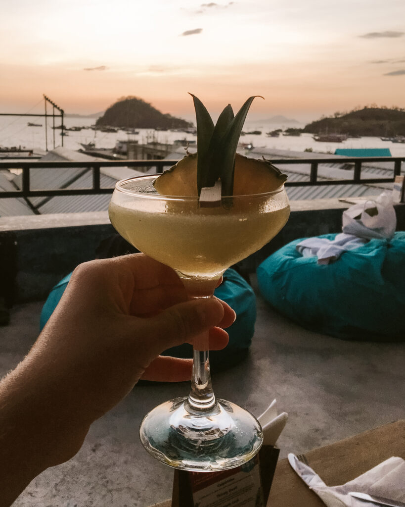 cocktail overlooking komodo labuan bajo bay